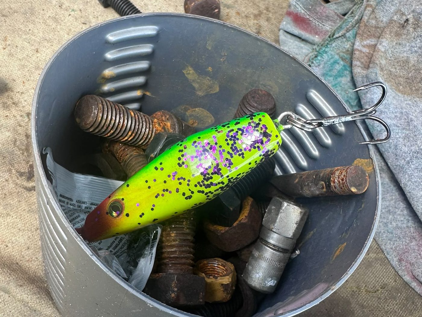 Proto 01 staged in a bucket of rusty hardware